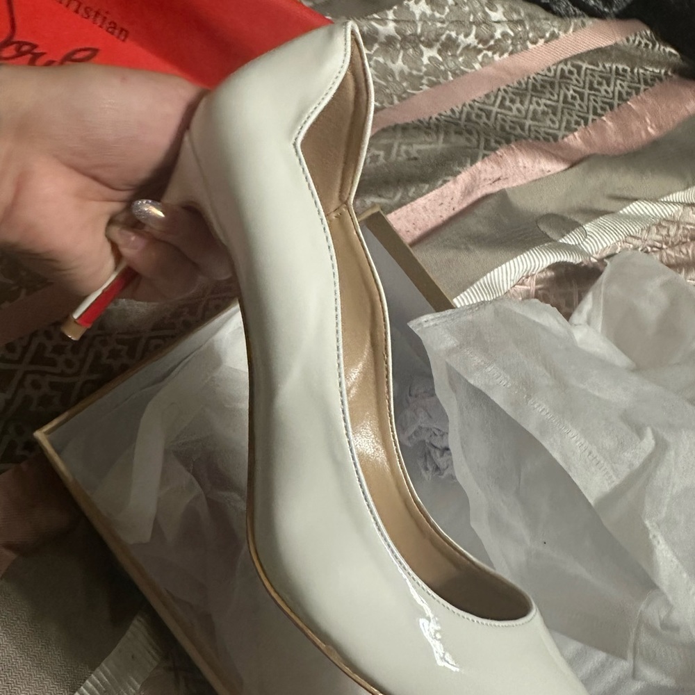 Christain Louboutin white heels. Only wore once for a photo shoot. Size 7.5
